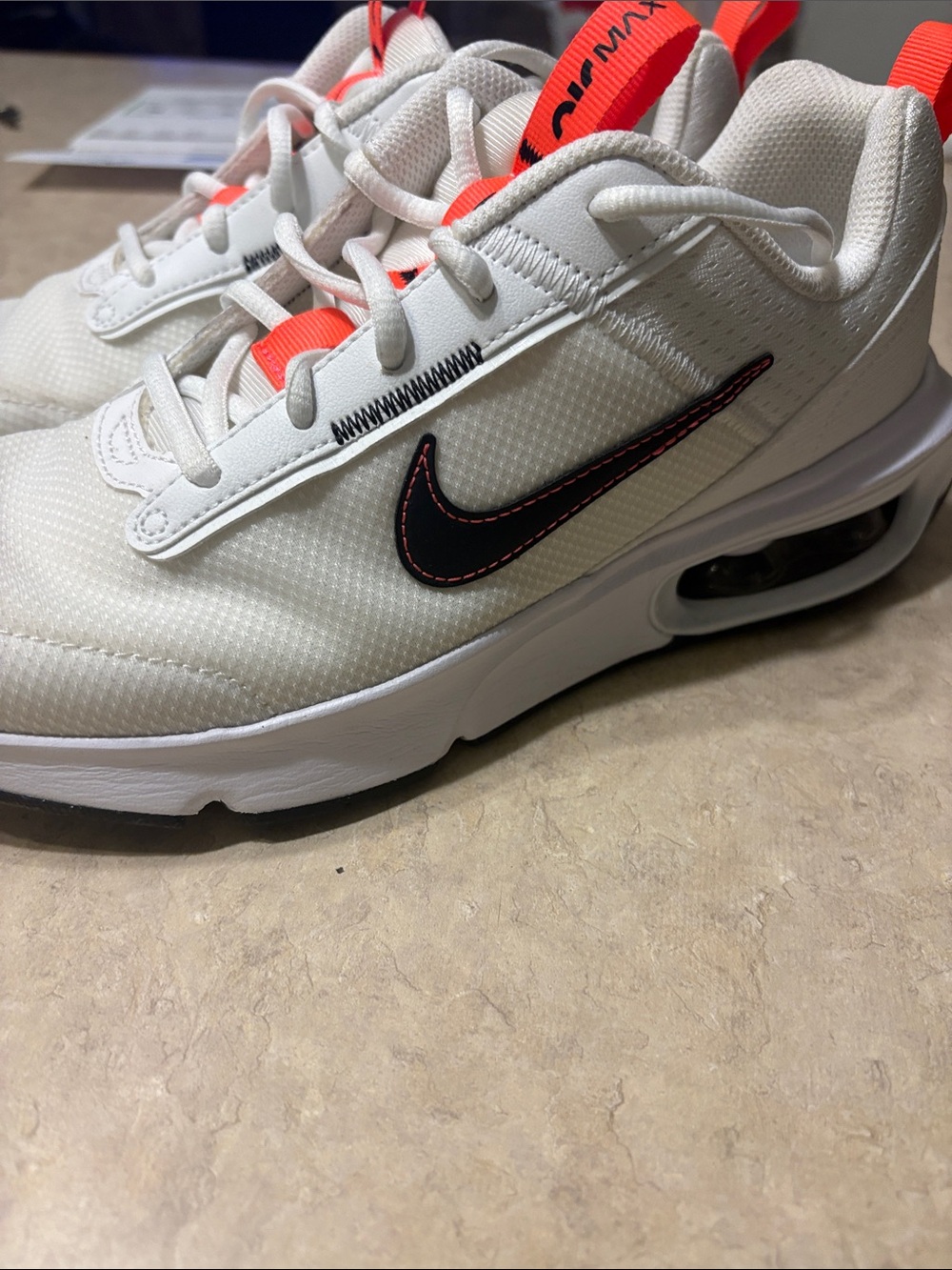 Nike YouthWhite Sneakers with Black Swoosh and Orange Pull Tabs